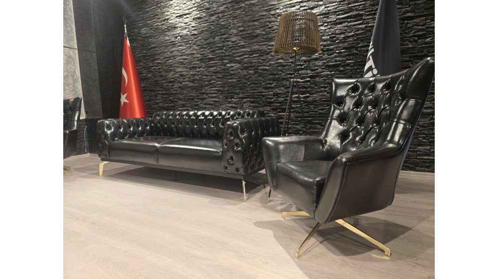 Tilia dönerli Chester ofis oturma grubu, siyah deri kapitone, gold renkli metal döner ayaklı tekli koltuklar ve sabit kanepeden oluşur.